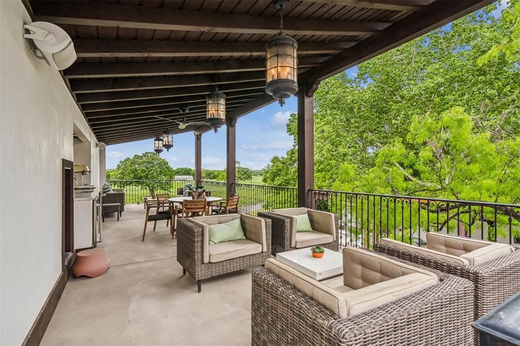 4136 Idlewild Drive has multiple patios and verandas all with shady, verdant views. (Photo by Norman & Young - Compass)