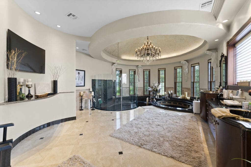 The elaborately decorated primary bath  at 401 Lakeshore Drive in El Lago, Texas.  (Photo by Iconic Images)