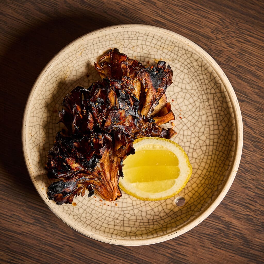 A favorite dish on the Uchiko Plano menu is the charred maitake. (Courtesy)
