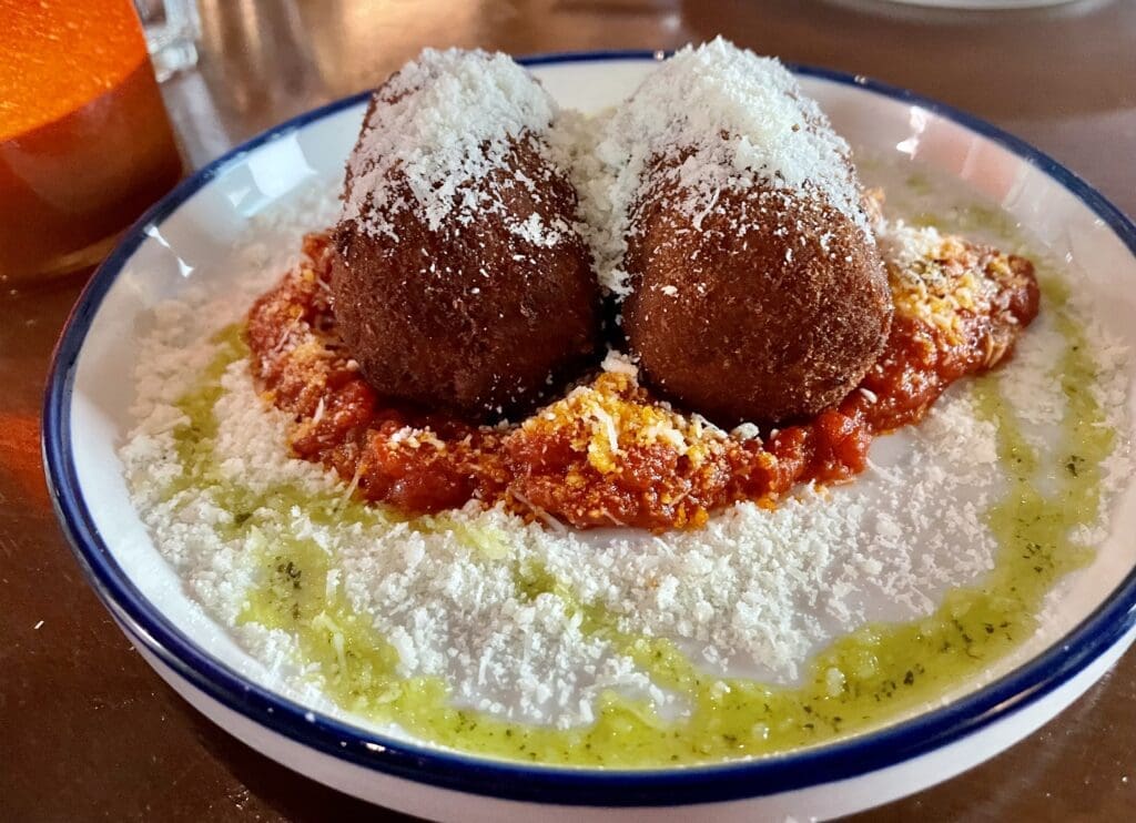 Suppli Al Telefono ― two crispy tomato risotto logs. (Photo by Courtney Dabney)