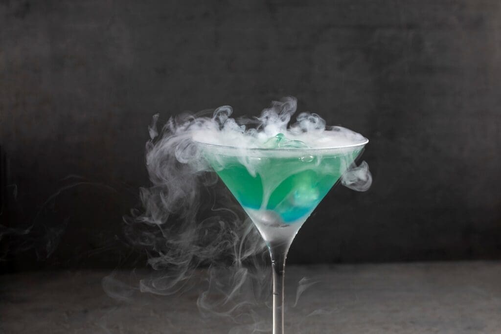 Step into the mist at Como Social Club’s "Boo-zy Bash"—where smoky green cocktails set the mood for a spellbinding night of Halloween fun and flavor.