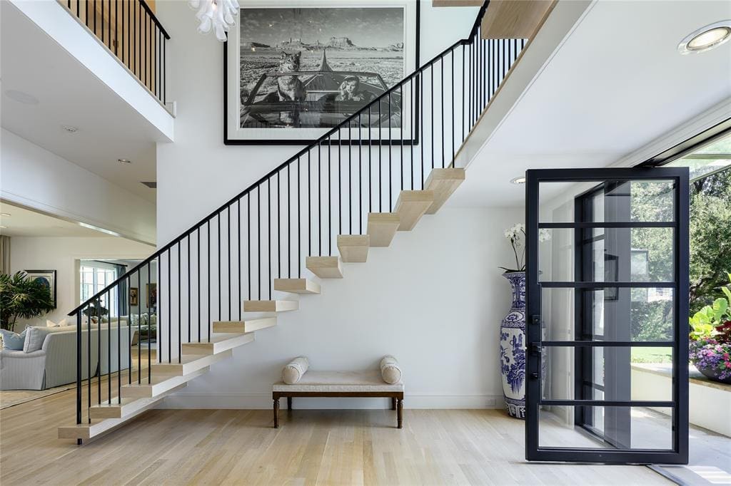 At 3509 Crescent Avenue, the entry greets you with white oak and a floating staircase.