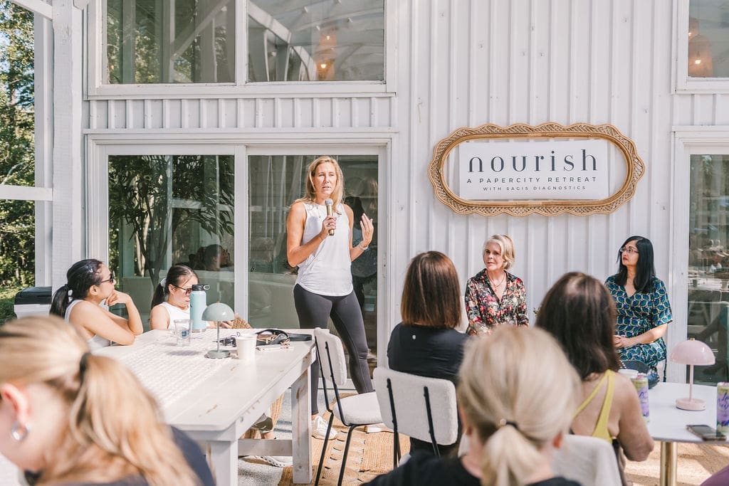 Sagis Diagnostics' Michelle Verbois Wasaff introduces wellness experts at PaperCity's Nourish retreat.  (Photo by Heather Robards)