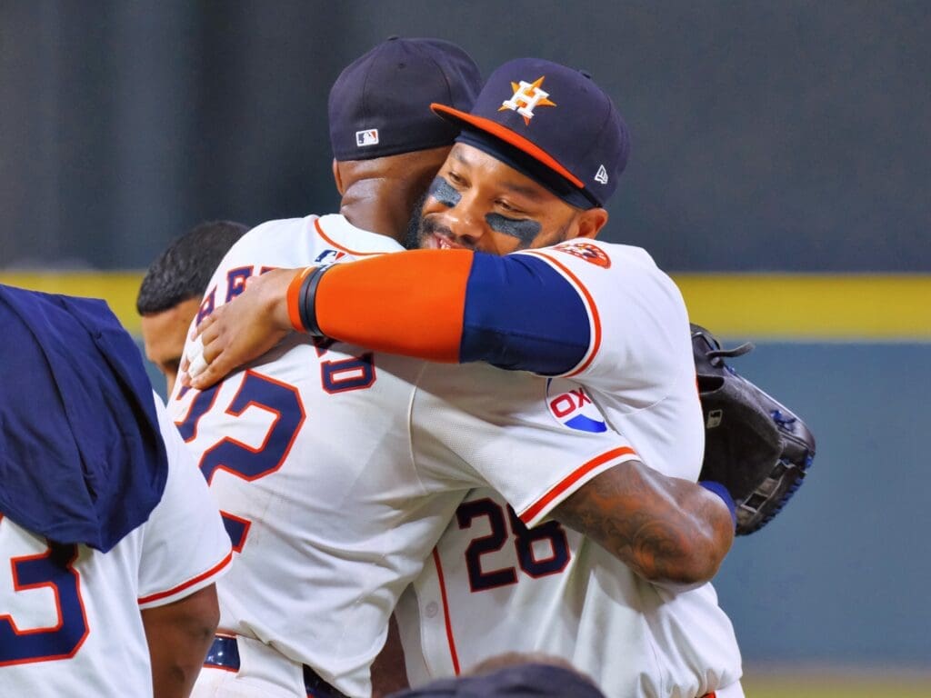 Jason Heyward and Jon Singleton hugged for another Astros championship moment. (Photo by F. Carter Smith)