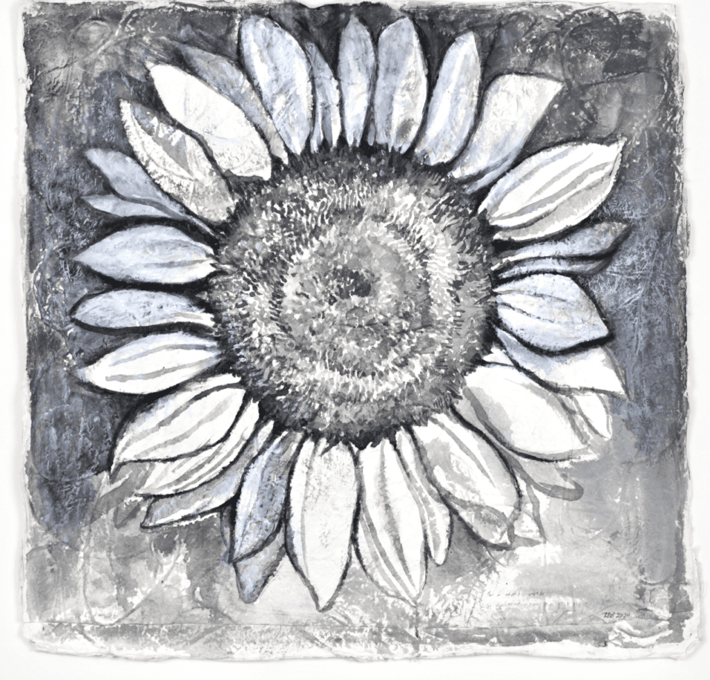 Multidisciplinary artist Lydia Bodnar-Balahutrak's sunflower painting invites viewers in with its contrast at Andrew Durham Gallery, as part of the “Side by Side, 20 x 20: Honduras Threads” exhibition.