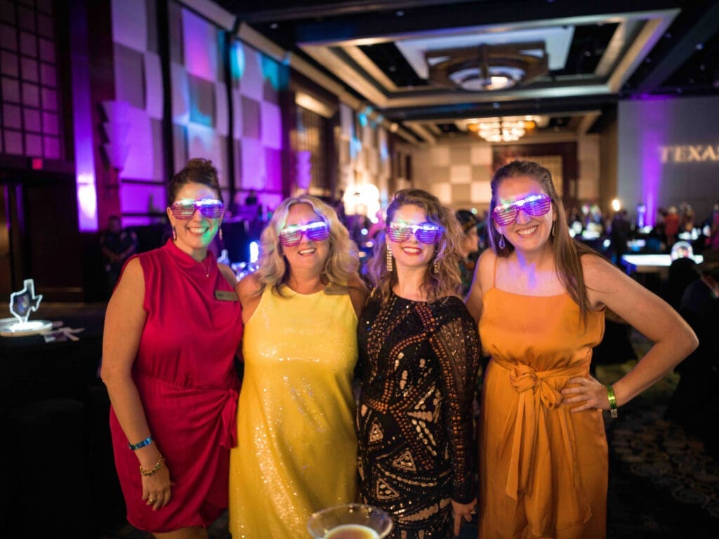 Attendees have a ball with light up glasses. (Photo by Daniel Ortiz)