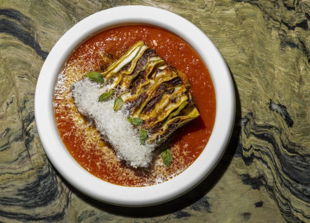 Milton's dish that’s caught the attention of many diners is the 100-layer lasagna. For the uninitiated, it’s made with semolina pasta, spinach pasta, béchamel, oxtail ragu and tomato sauce, repeated again and again (20 times in total). (Photo by Julie Soefer)