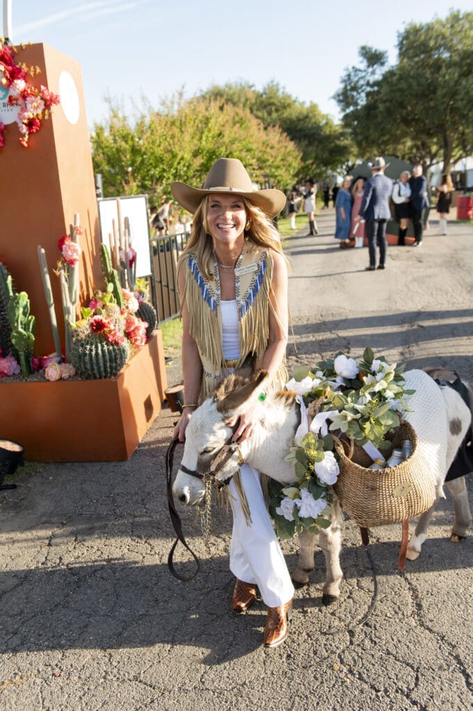 2025 Cattle Baron's Ball Co-Chair Dr. Courtney Derderian with Johnny Cash the Beer Burro (Photo by Tamytha Cameron and Celeste Cass)