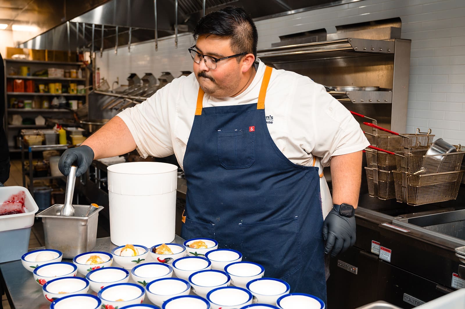 Chef Luis Lopez of Killen's Steakhouse plates dishes at Phat Eatery's tribute dinner honoring Alex Au-Yeung.