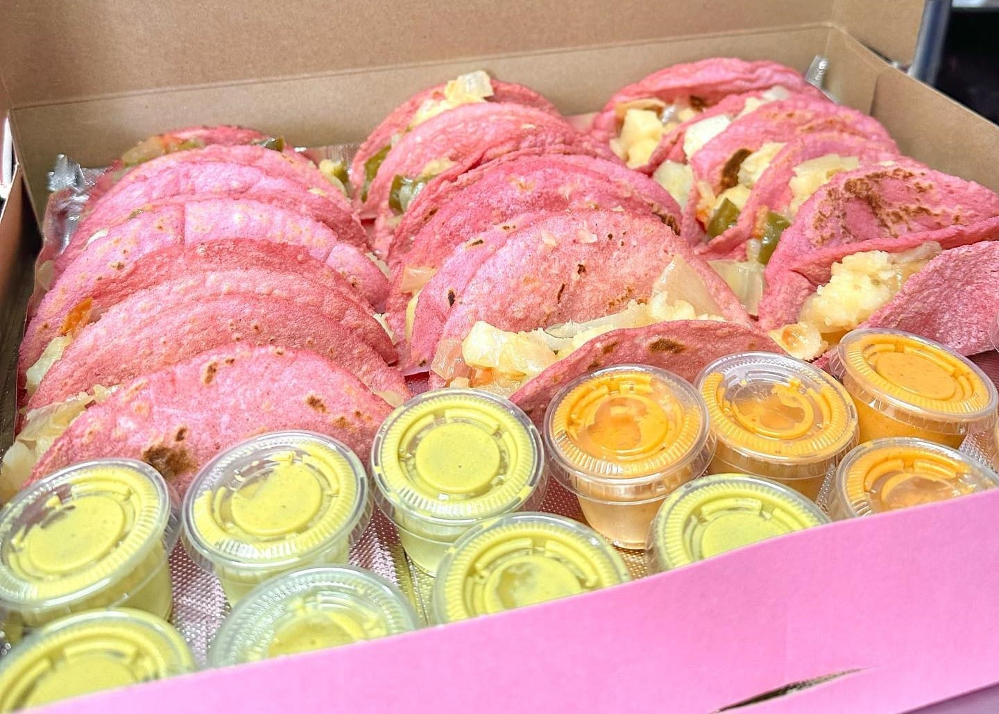 Cafecitio is known for its pink hued tacos