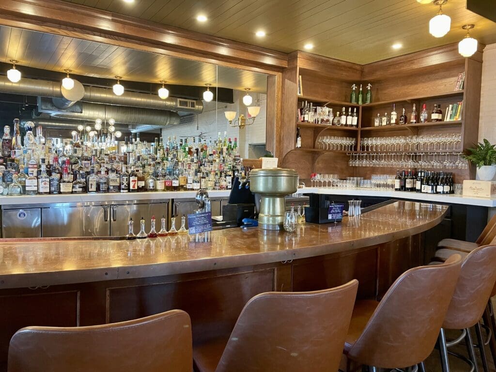 Clay Pigeon's copper topped bar has been refreshed with comfy new seating and a built-in mirror behind the bar back. (Photo by Courtney Dabney)