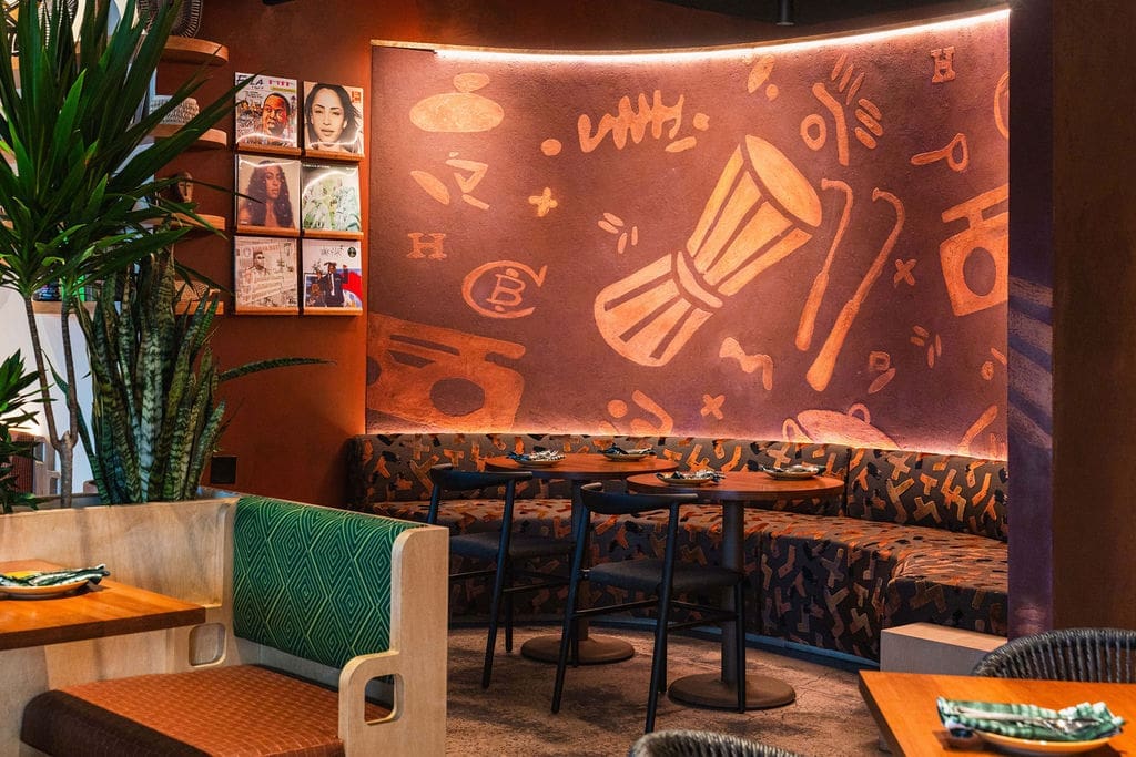 The stenciled mud wall highlights ChòpnBlọk's signature pattern. (Photo by StuffBenEats)