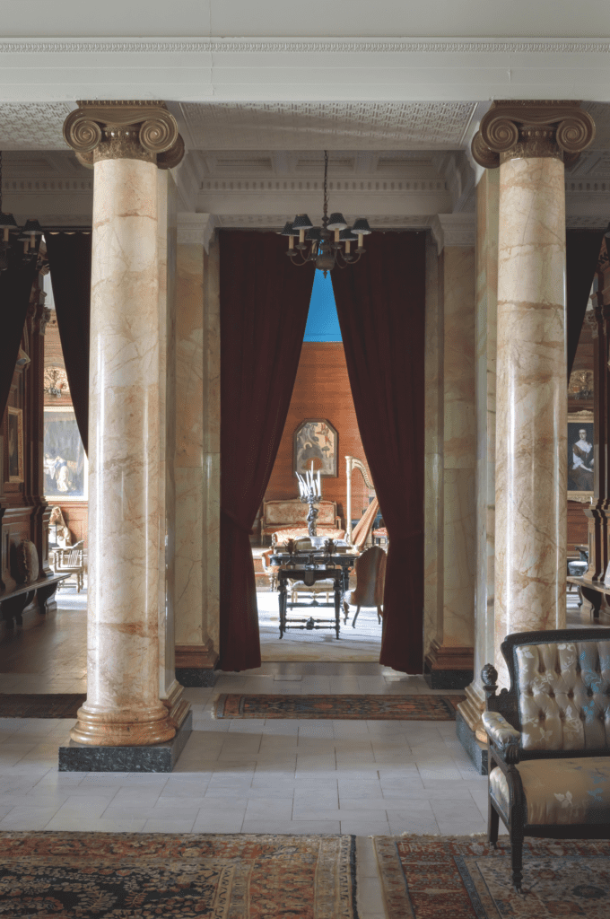 The two-story atrium at Searles Castle highlights Hunt Slonem's love affair with Gilded Age mansions. (Photo by John Neitzel)