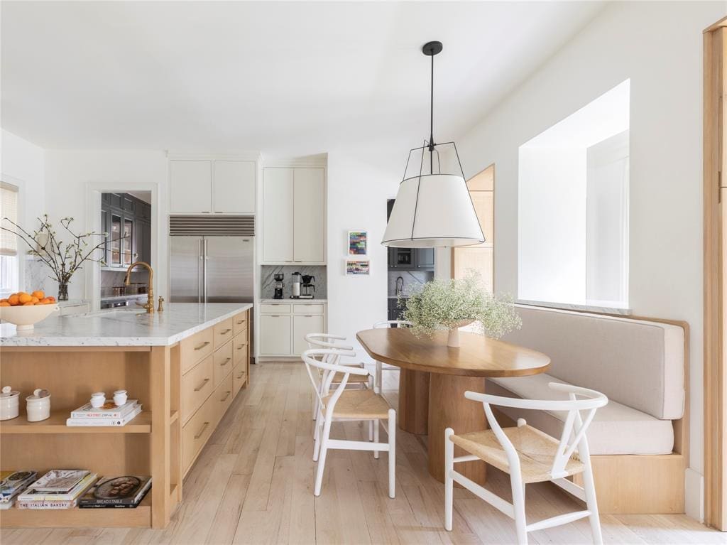Listed with Compass, the home features a beautiful kitchen and breakfast area.