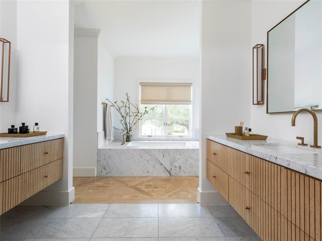 The primary bath is worthy of a five-star hotel.
