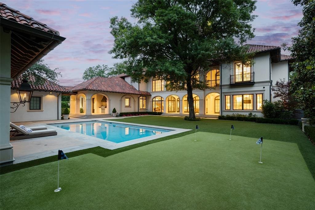 4307 Armstrong Parkway's backyard features a pool, putting green, fireplace, and outdoor kitchen. (Courtesy)