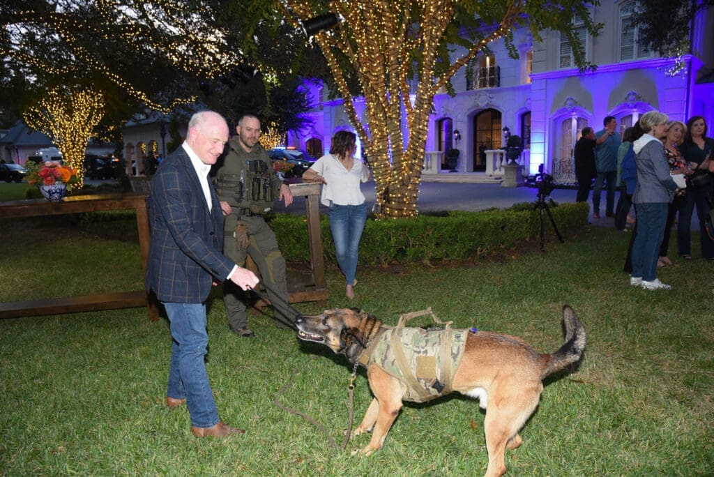 Brett Sanders with HPD K-9 Nate at the Houston Police Foundation True Blue fundraiser   (Photo by Alexander's Fine Portrait Design )