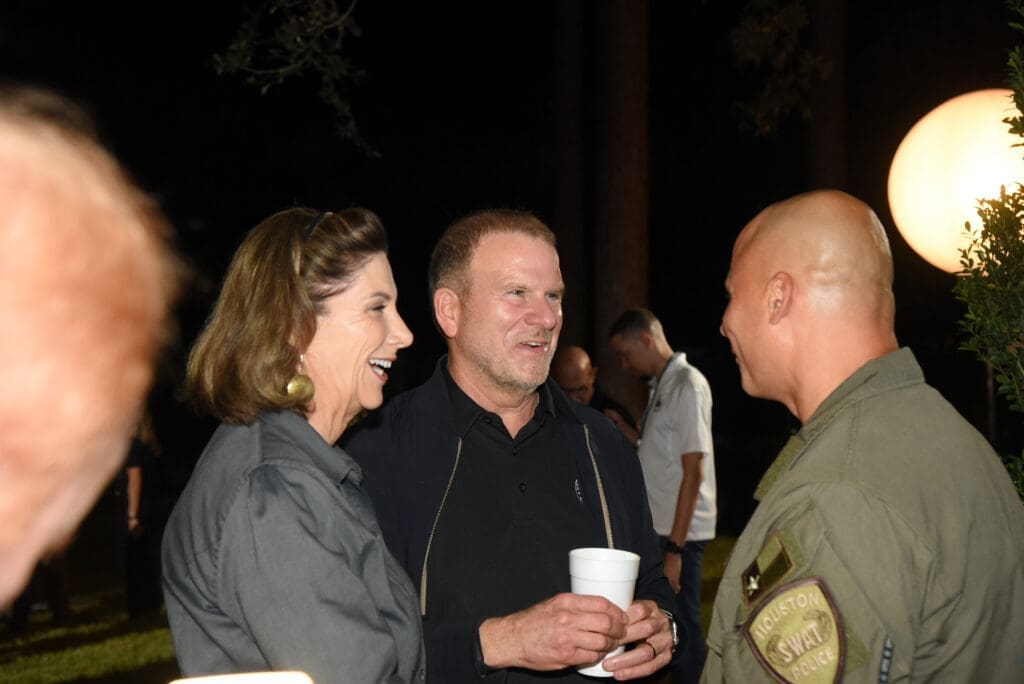 Foundation executive director Charlene Floyd, foundation board chair Tilman  Fertitta with SWAT Officer at the Houston Police Foundation True Blue fundraiser   (Photo by Alexander's Fine Portrait Design )