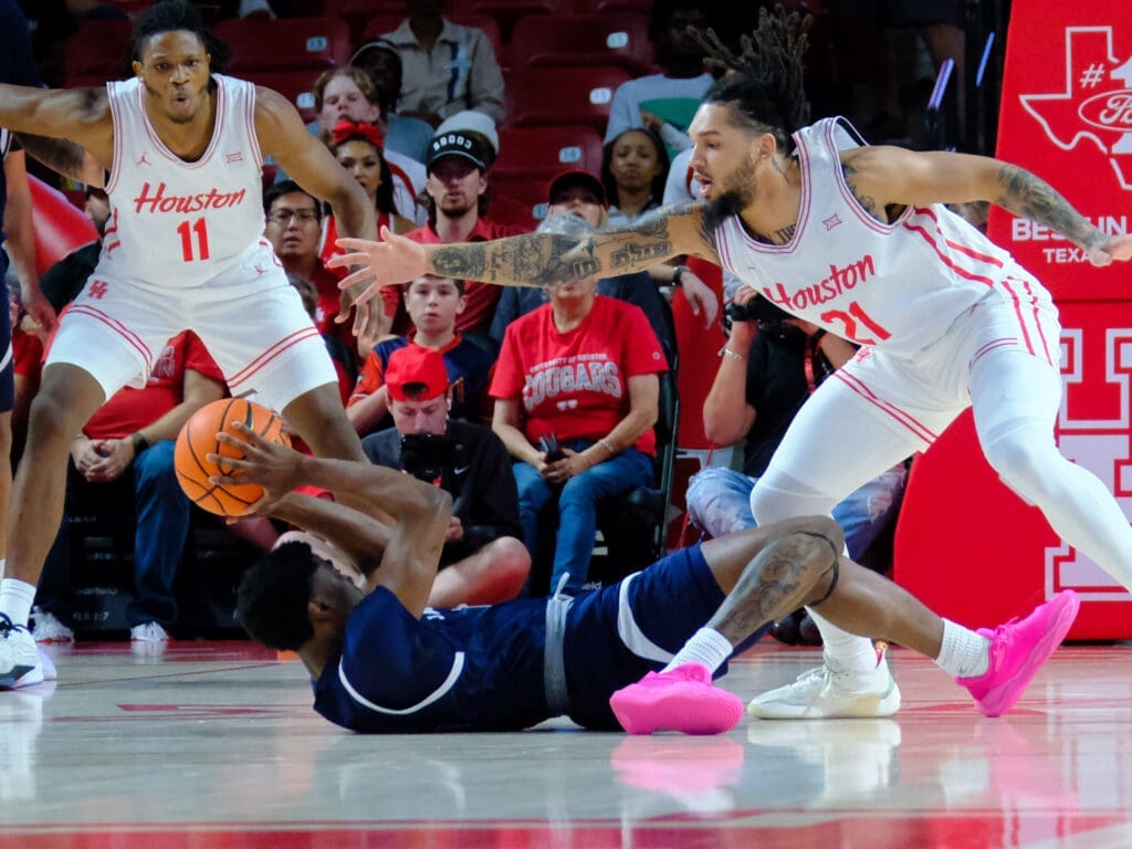 It is not easy to stay upright against Emanuel Sharp, JoJo Tugler and the rest of this University of Houston defense.(Photo by F. Carter Smith)