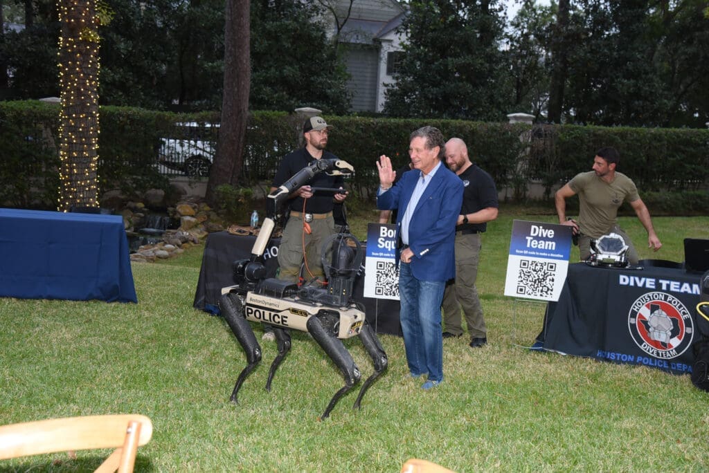 HPD's K-9 robot 'Spot" with Carroll Smith at the Houston Police Foundation True Blue fundraiser   (Photo by Alexander's Fine Portrait Design )