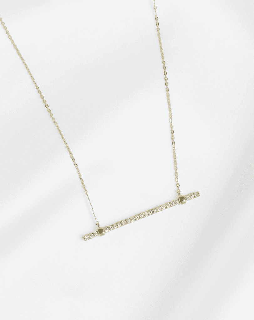 PaperCity and Diamonds Direct are partnering up to give away a a 14k yellow gold and diamond bar pendant that is valued at $1,500!