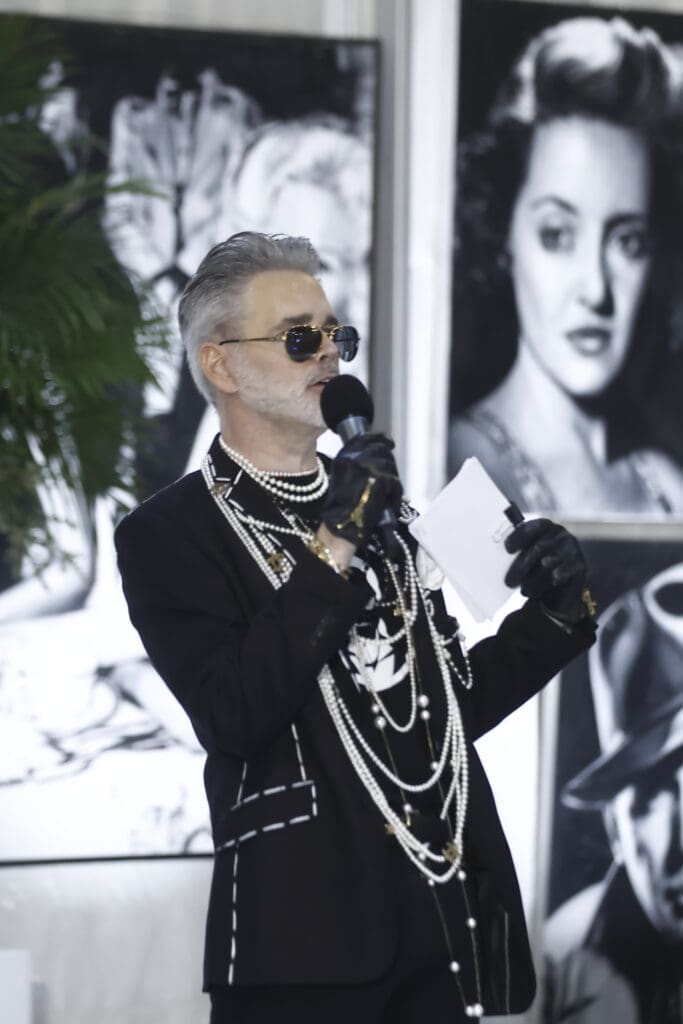 Houston's Michael Pearce emcee'd the Fashion Woodlands event at the home of Theresa Roemer.