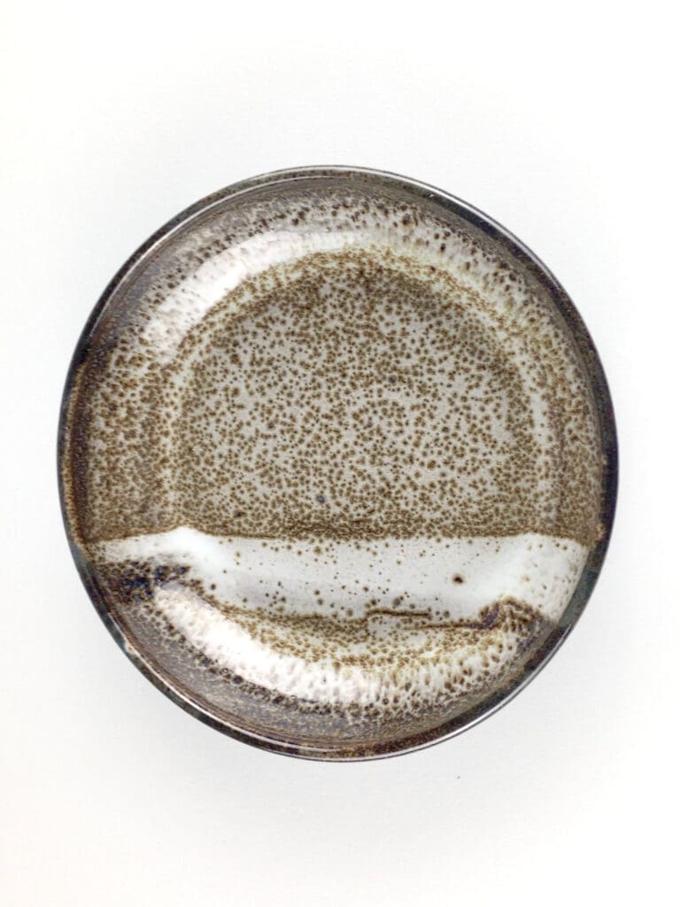 This set of four stoneware bowls features a stunning faux oil spot finish for a touch of elegance. (Photo courtesy Linda Perez Ceramics)