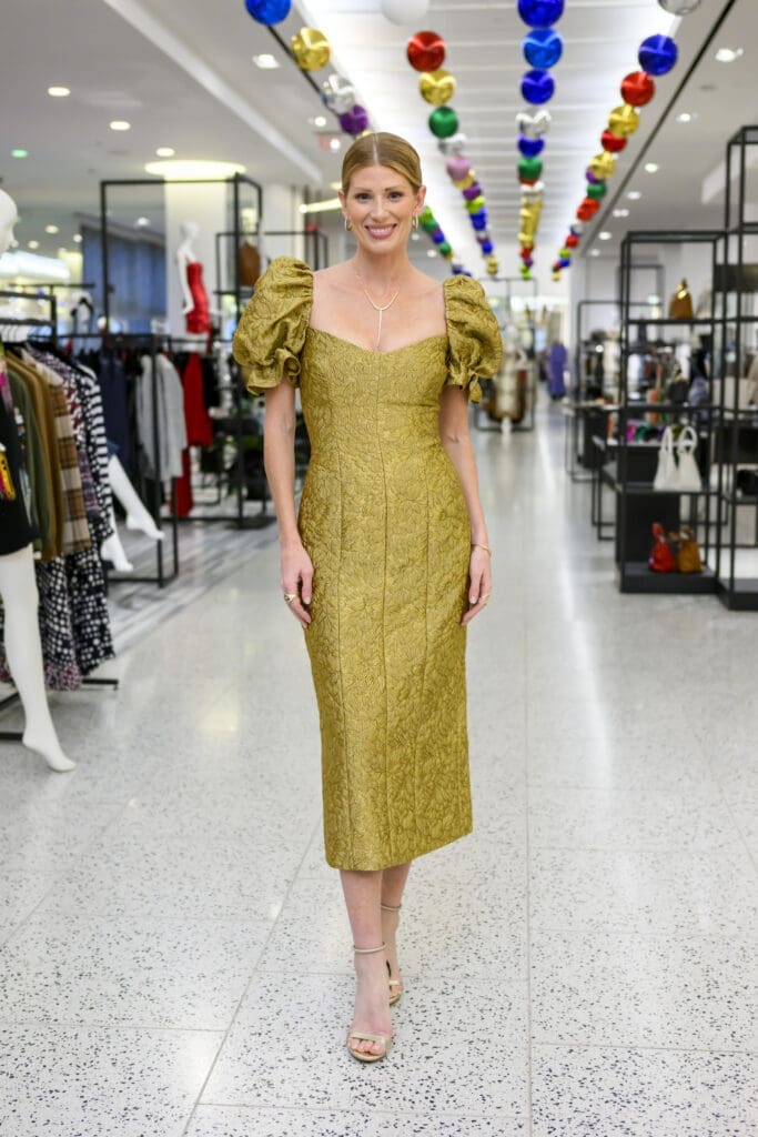 Designer Alexandra O'Neill will be wearing the Farrah Gold Brocade Midi Dress this holiday season.