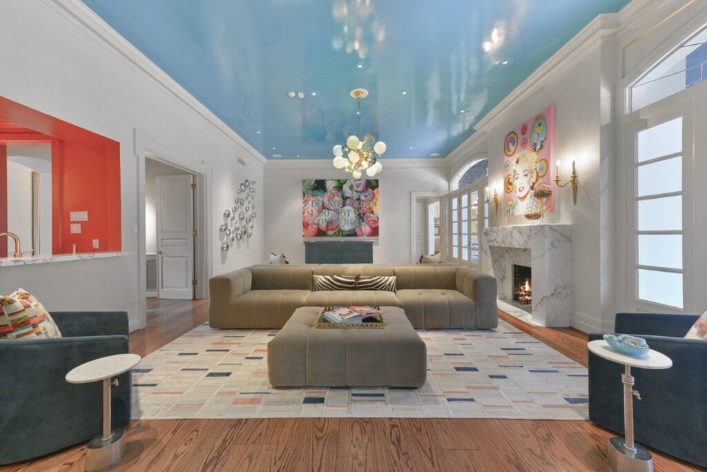 A wider perspective on the fanciful living room with a lacquered ceiling at 1069 Kirby Drive.