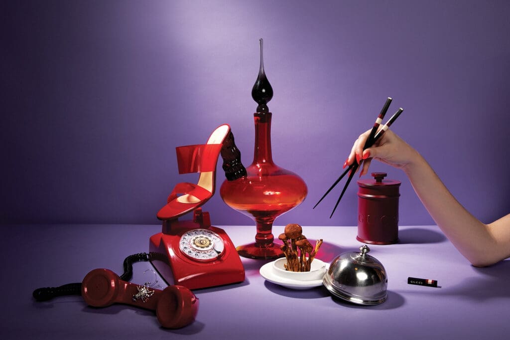 Vintage Blenko tangerine large decanter $585, at windowswhome.com. Paul Andrew glass tomato shoe $1,395, at The Conservatory. Gucci wooden chopsticks with web detail $650, Oud Eclipse mini basket candle $450, at select Gucci boutiques, farfetch.com, net-a-porter.com. Estate lobster pin in white gold with diamonds $1,750, at tenenbaumjewelers.com. Match Convivio butter dome $172, at kuhl-linscomb.com. (Photo by Tony Solis)