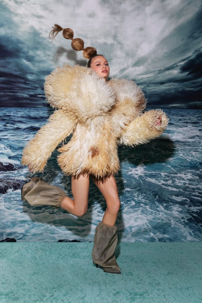 McQueen by Seán McGirr natural shearling coat $13,000, and bag boot $1,860, at Neiman Marcus, Tootsies, farfetch.com, net-a-porter.com, alexandermcqueen.com (Photo by Tony Solis)