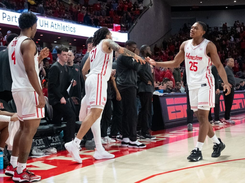 University of Houston guard Emanuel Sharp shows support for freshman Mercy Miller. (Photo by F. Carter Smith)