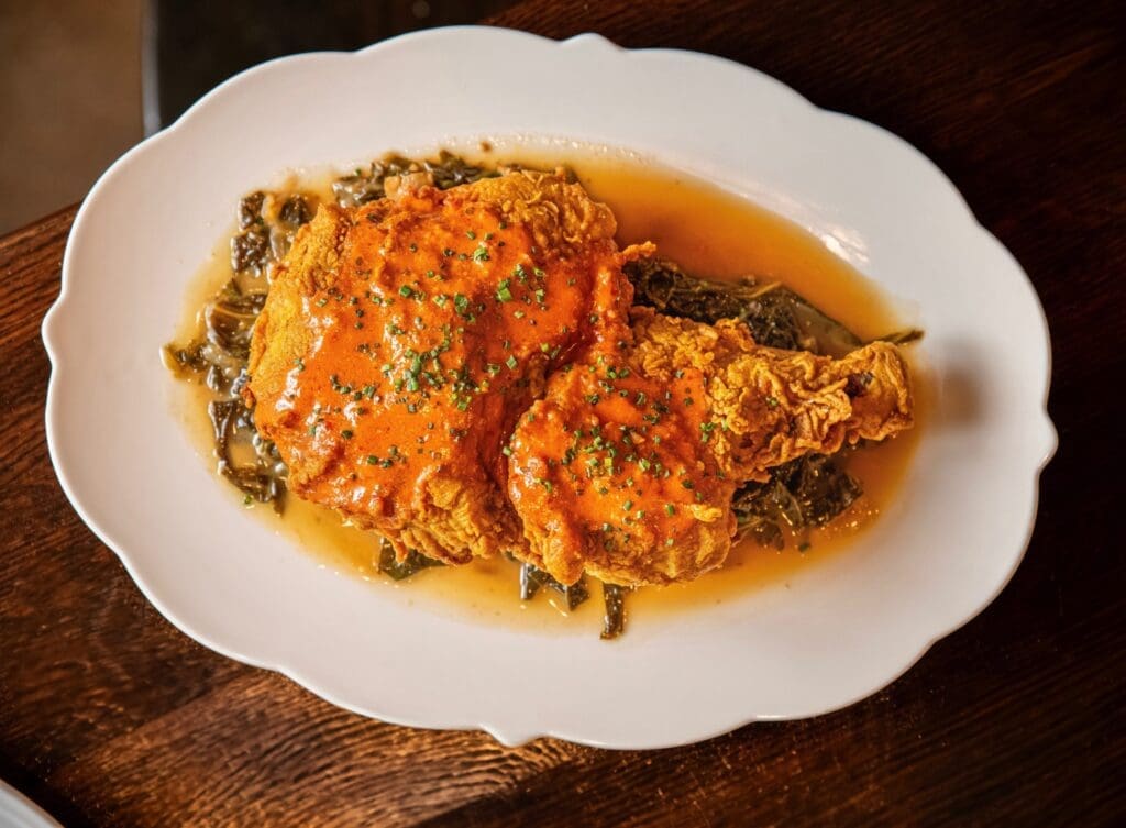 The fried chicken with cornbread brioche at Pillar is one of the best dishes we've had at new Dallas restaurants in 2024. (Courtesy)
