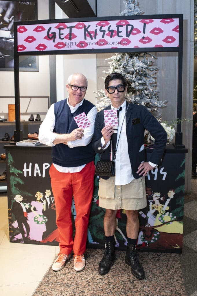 Local artist Donald Robertson created a "kissing" booth with cards for PaperCity's Billy Fong to hand out for the holidays. (Photo by Tamytha Cameron)