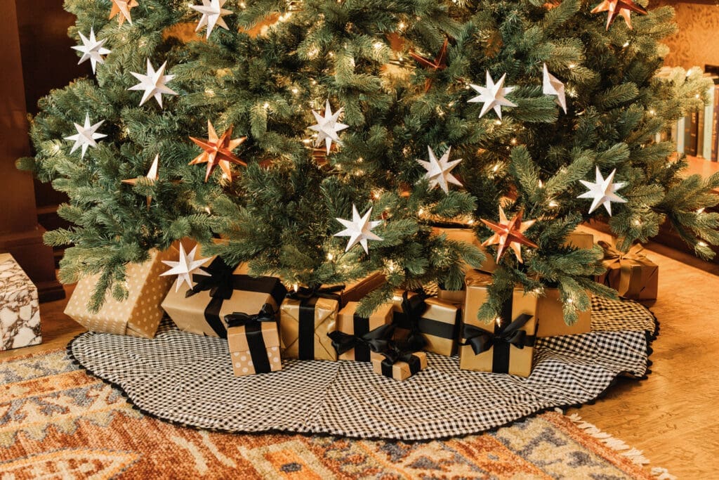 The reversible tree skirt features black-and-white gingham on one side.