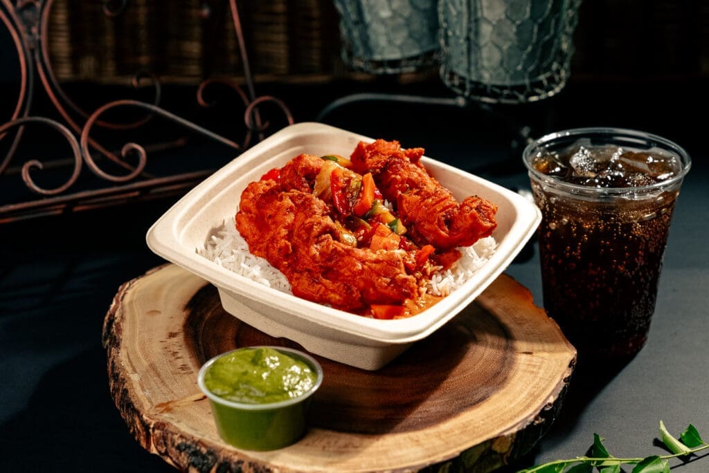 The Loaded Rice & Shine ($11.99) at Pok Pok Po combines steamed basmati rice (made every four hours to ensure its freshness) with crispy chicken thigh or breast, house-made sauce, and desi kimchi. (Photo by Alex Montoya)