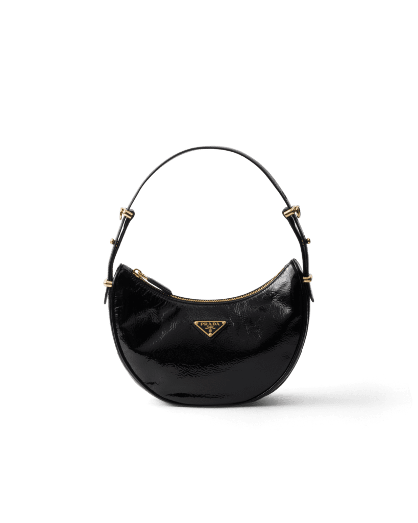 Prada Arqué naplak patent leather shoulder bag, $2,750, available at the Prada boutique.