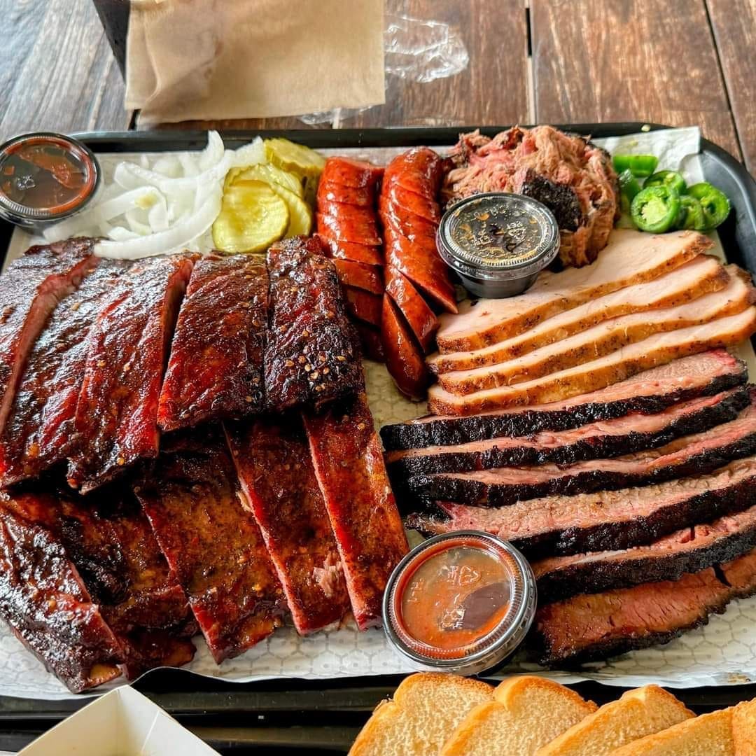 A mouthwatering platter of meats and sausages from Corkscrew BBQ shows its Michelin star-worthy power.