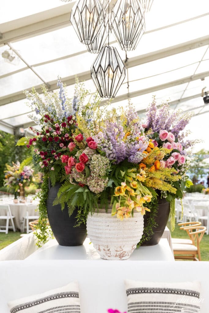 Lavish florals decorate the party tent for the Clay/Chapman wedding. (Photo by John Cain)