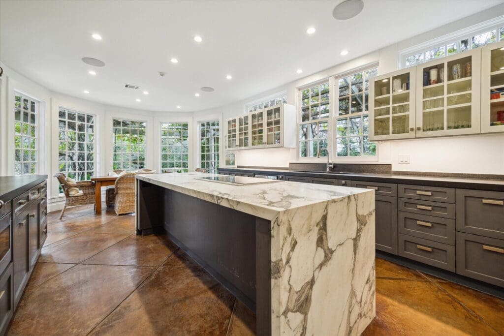 The modern kitchen at 8899 Sandringham in Houston's Bayou Woods subdivision (Photo by TK Images/Compass)