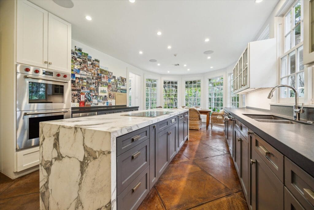 The modern kitchen at 8899 Sandringham in Houston's Bayou Woods subdivision (Photo by TK Images/Compass)