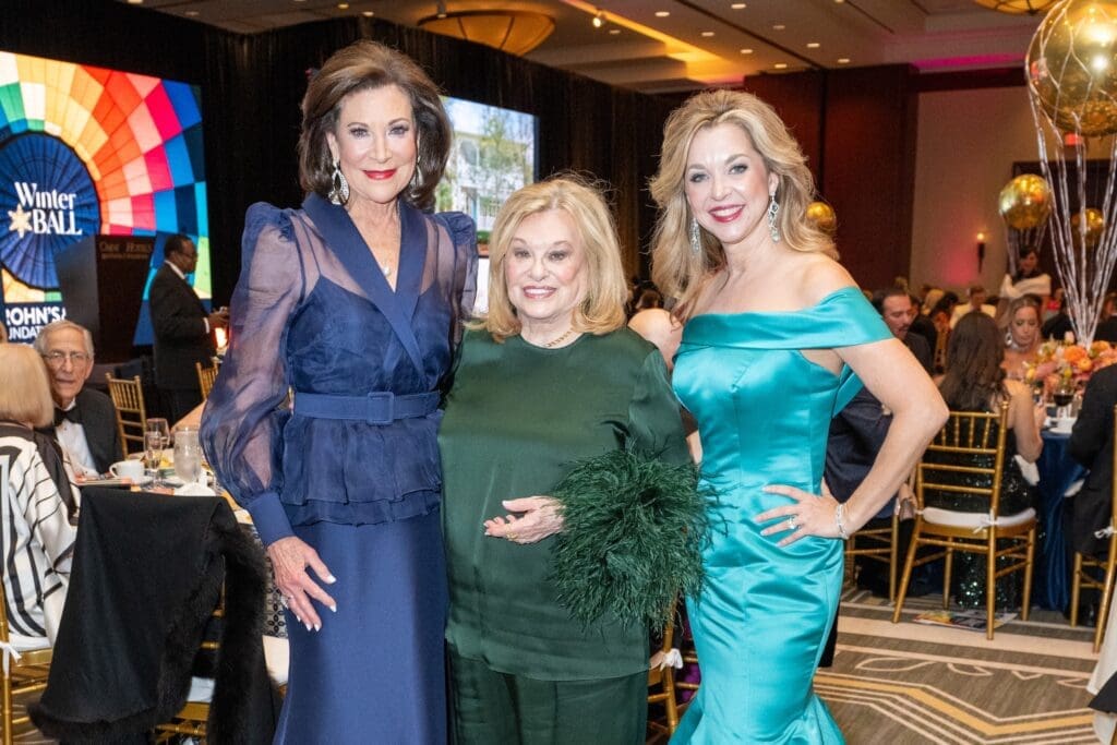 Former honorees Betty Hrncir and Sidney Faust with 2025 Woman of Distinction Julie Baker Finck (Photo by Jacob Powers)