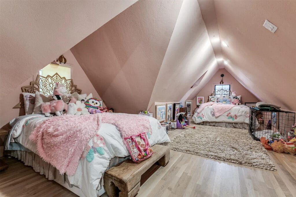 The additional bedrooms provide flexibility "for any lifestyle," though the current set-up seems ideal. (What little girl didn't dream of a lofted bedroom up a spiral staircase, reading with her legs propped up against the slanted ceilings?)