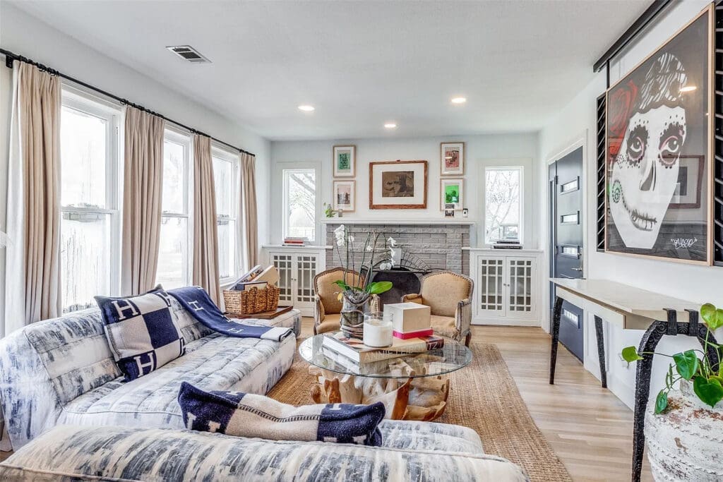 On quiet nights, read in the living room as a fire roars in the original fireplace at 1023 North Edgefield Avenue.