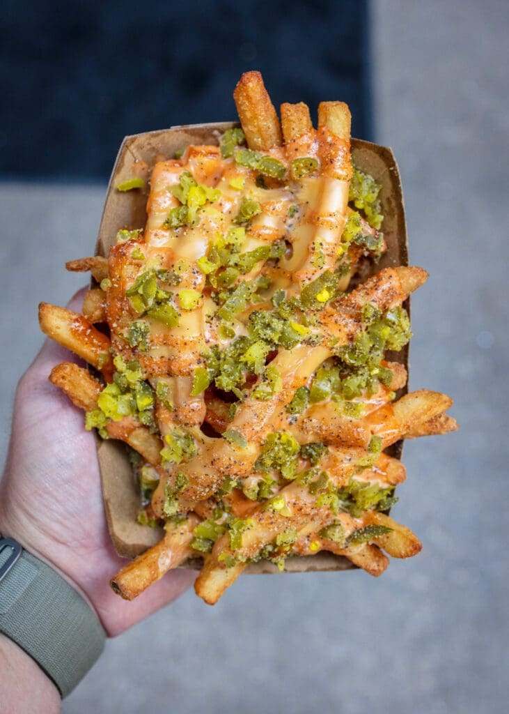 The Beast Mode fries at NADC Burger come loaded with cheese, jalapeños, pickles, and NADC special sauce. (Photo by Taylor Elliot)