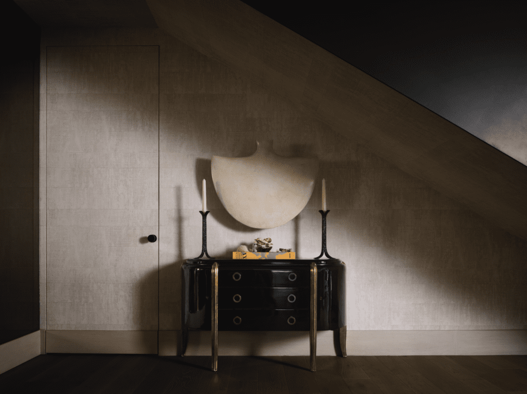 Ebony console from Jean de Merry, bronze Ingrid Donat candle holders from Carpenters Workshop Gallery, Paris. Wall art by Xawery Wolski. Élitis wallcovering from George Cameron Nash. (Photo by Douglas Friedman)