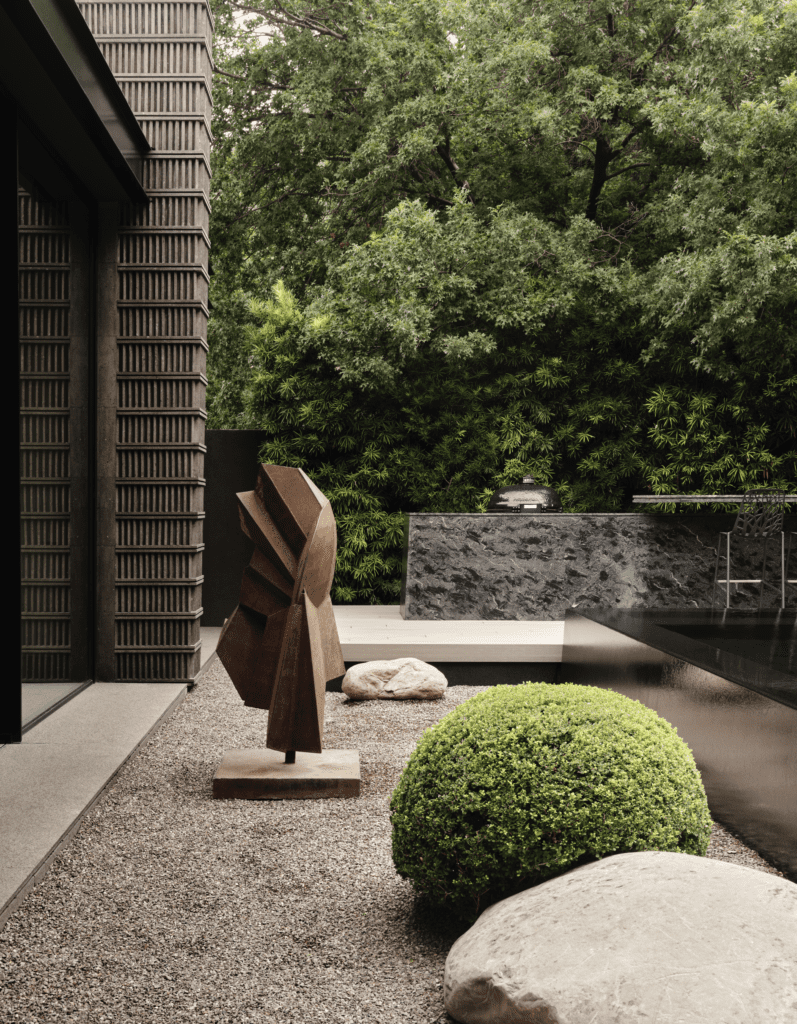 Sculpture by Austrian artist Gerda Gruber. Ancient Aztec stelae inspired the pattern for the exterior’s carved Mexican limestone. (Photo by Douglas Friedman)