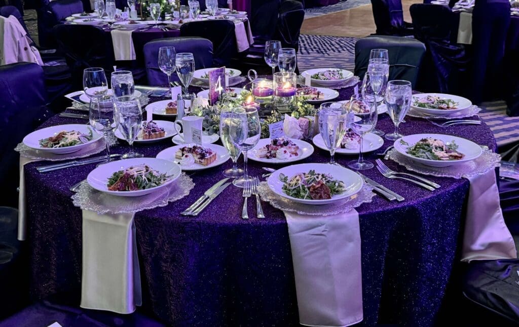 Even the tables shimmered in violet with stunning centerpieces at the Mosaics' Gala. (Photo by Jillian Richstone) 