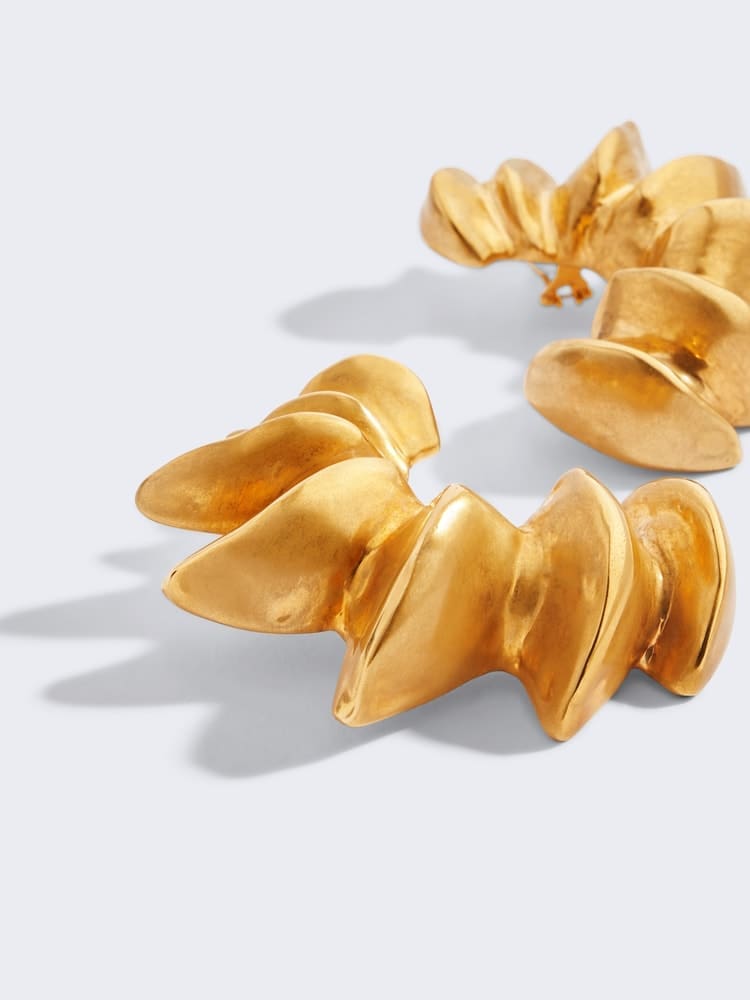 The flagship Downtown Dallas Neiman Marcus is one of three locations in the country that sells Schiaparelli, the surrealist house that Daniel Roseberry built. You are both shopping local AND supporting homegrown talent (Roseberry is from Plano), then, by requesting a pair of Schiaparelli earrings for Valentine's Day, like these Croissant Earrings ($2,200). (Photo courtesy of Schiaparelli)