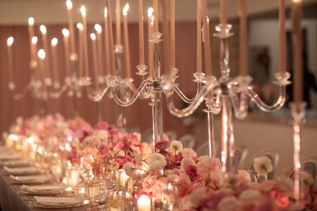 Crystal candelabra and bountiful flowers dress the wedding table for Hallie Vanderhider & Bobbie Dees (Photo by Kara Martinez)